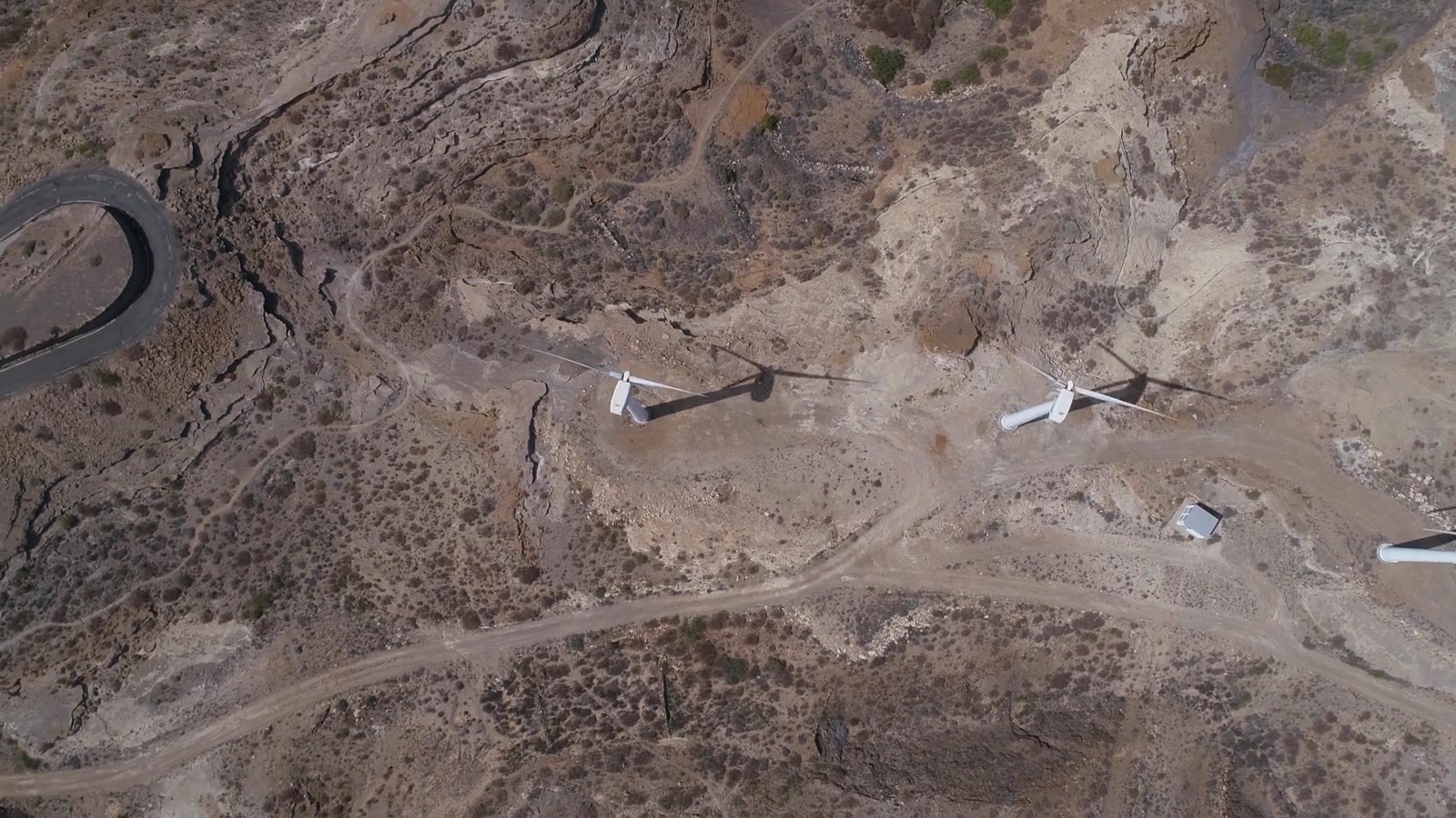 Wind turbines operate across a wide landscape.